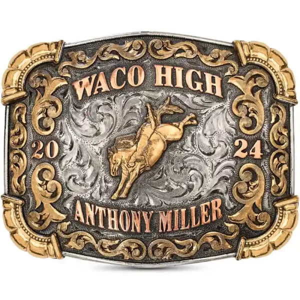 Introducing the Waco Belt Buckle—a classic symbol of tradition and excellence! This German Silver buckle features Jeweler's Bronze shells and scrollwork, with striking Copper letters and hand-engraved details. 